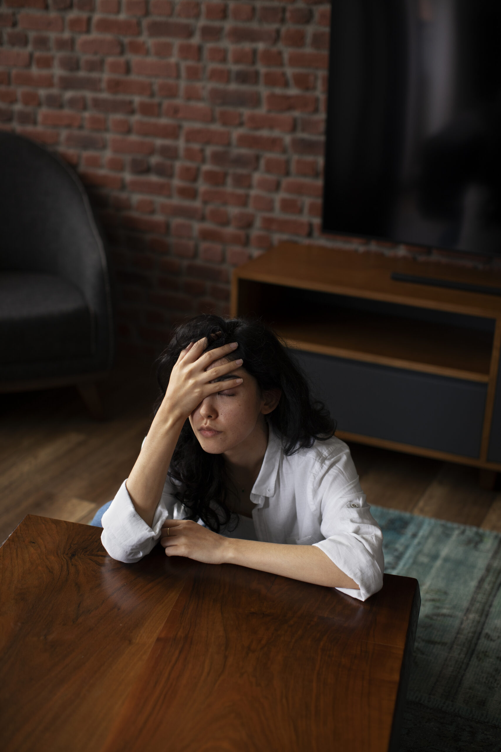 Woman with anxious expression, representing effects of disrupted natural hormonal balance